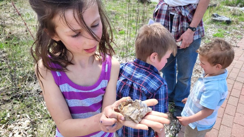 child holding a fossil